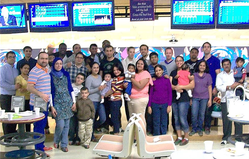 Photo of Hurley residents, fellows, and family at a bowling outing